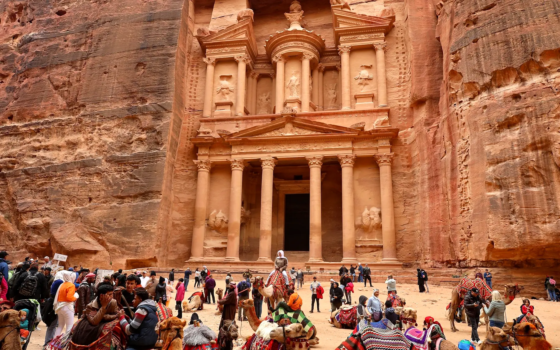 The Treasury carved into the sandstone cliffs at Petra, Jordan