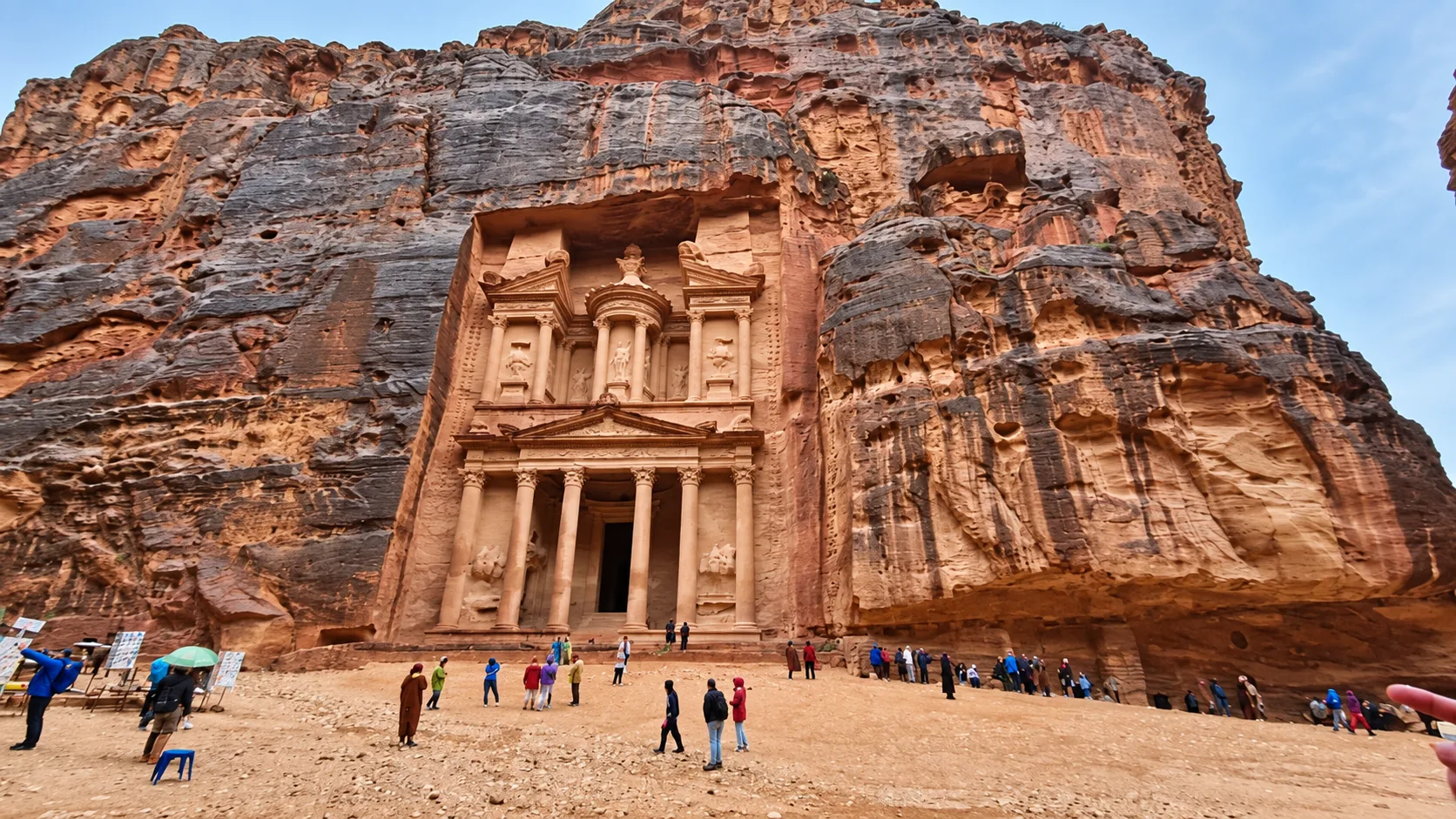 The Treasury carved into the sandstone cliffs at Petra, Jordan