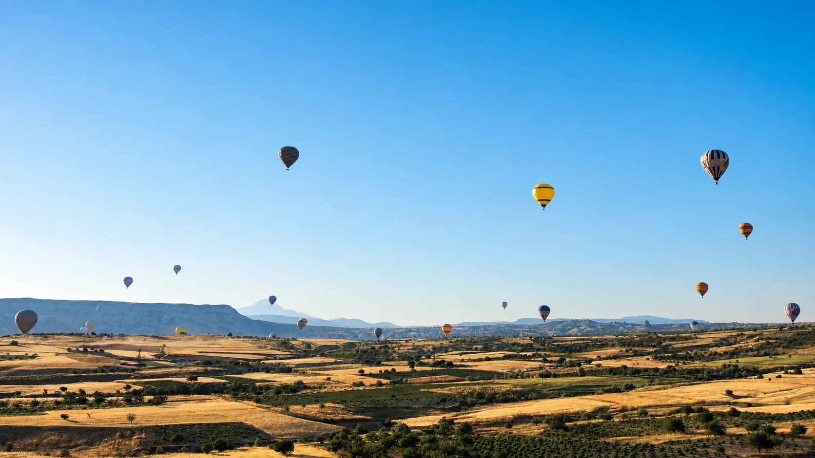Hot air balloons over the valleys of Cappadocia, Turkey